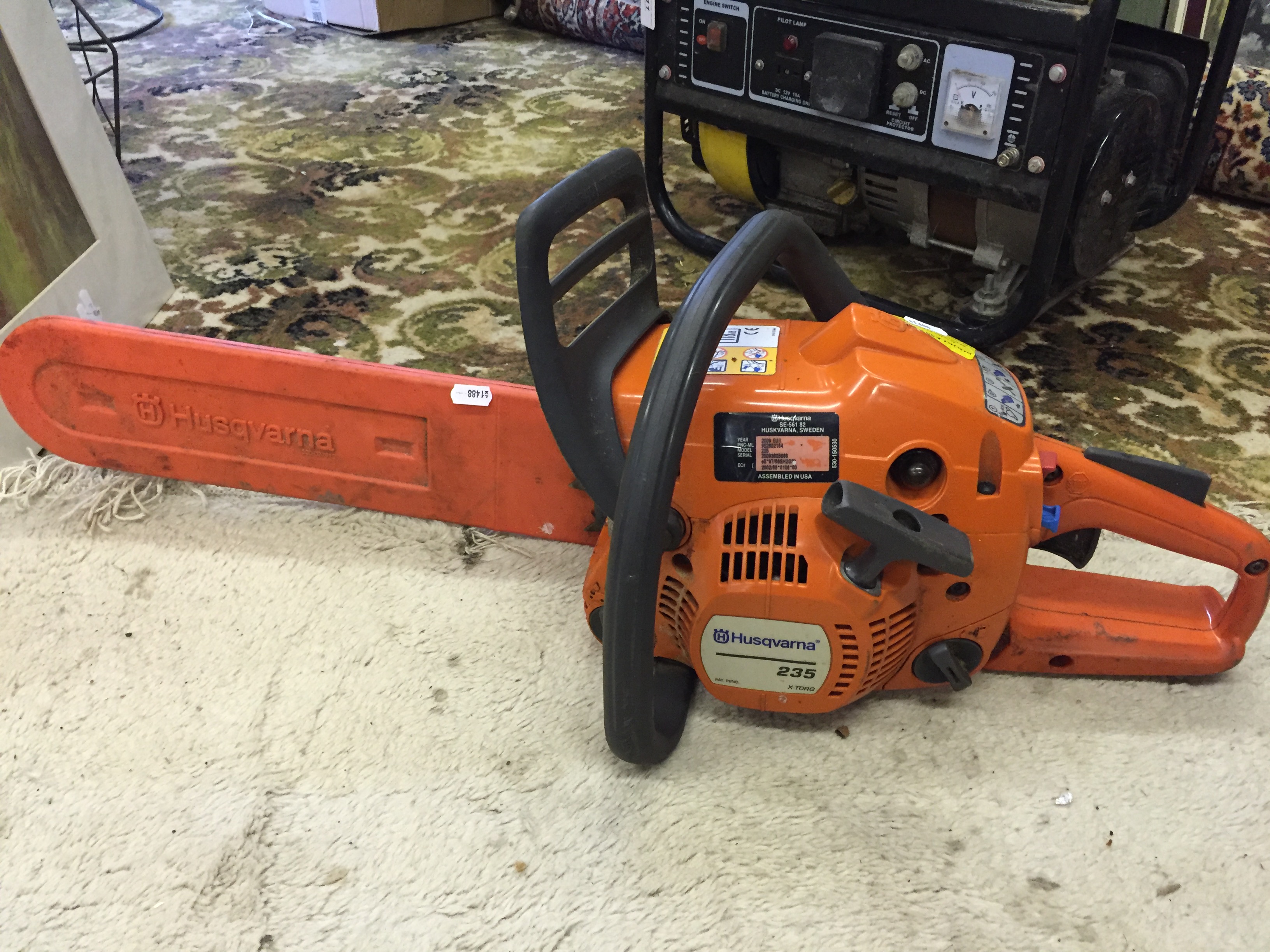 A Husqvarna 235 chain saw.