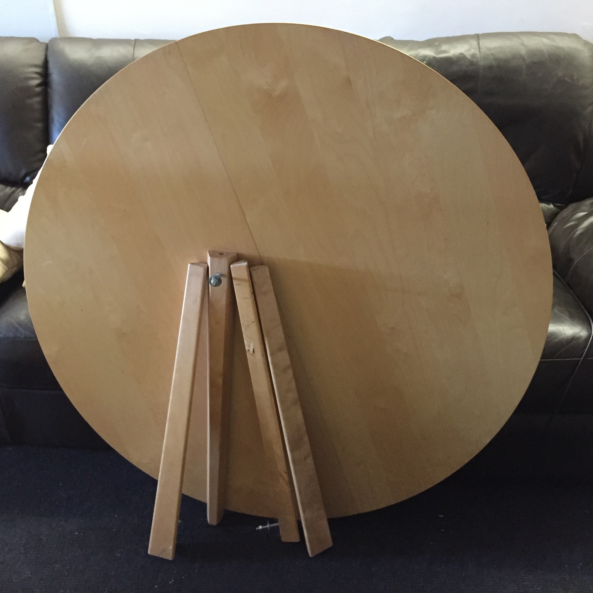 A large circular extending dining table.