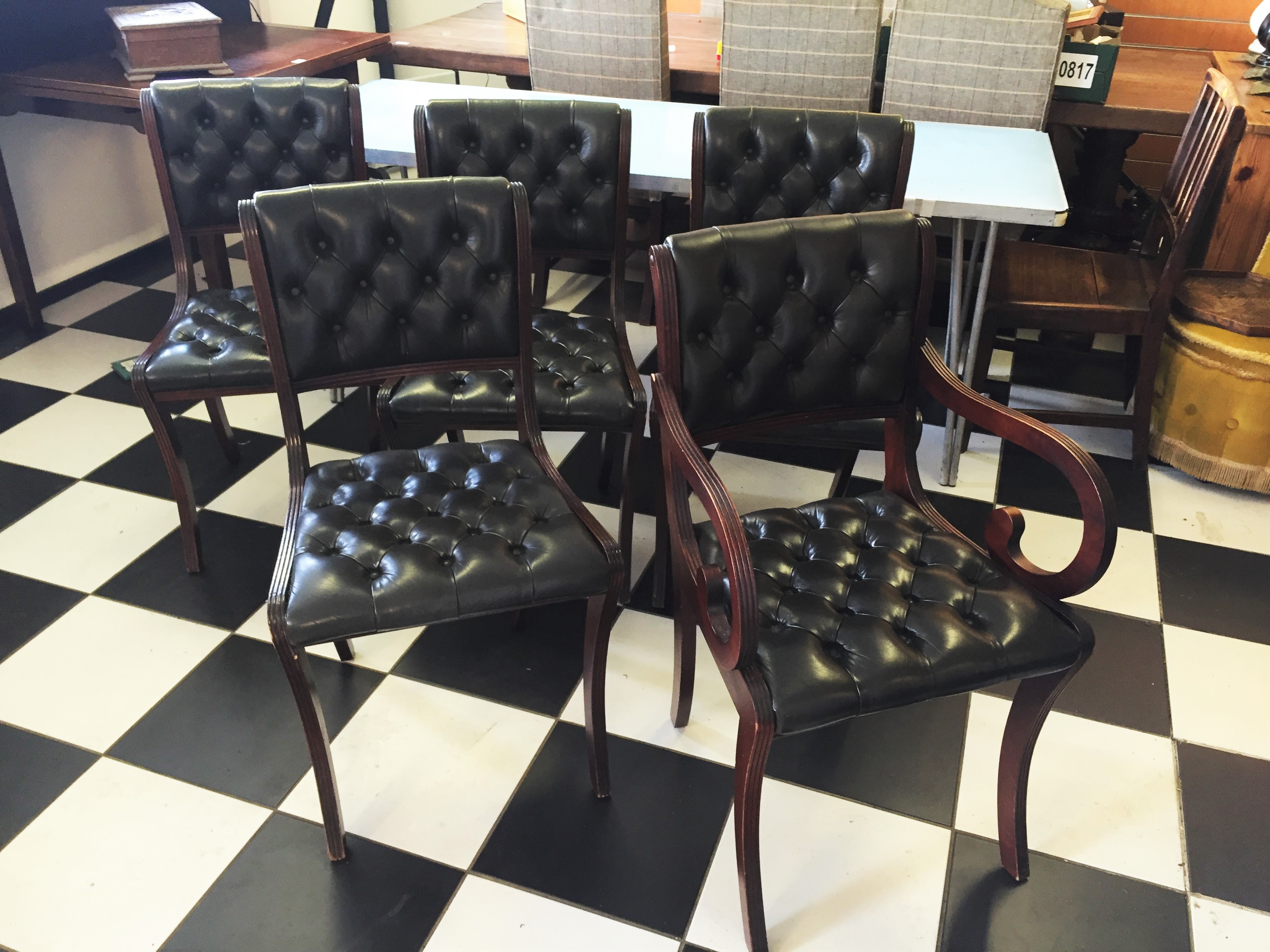 Six leather upholstered dining chairs with two carvers Beresford & Hicks.