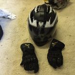 A motorcycle helmet and gloves.