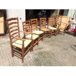 *A set of six oak ladder back dining chairs with rush seats two newly refurbished.
