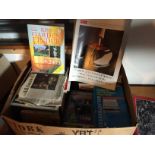 A box of various books.