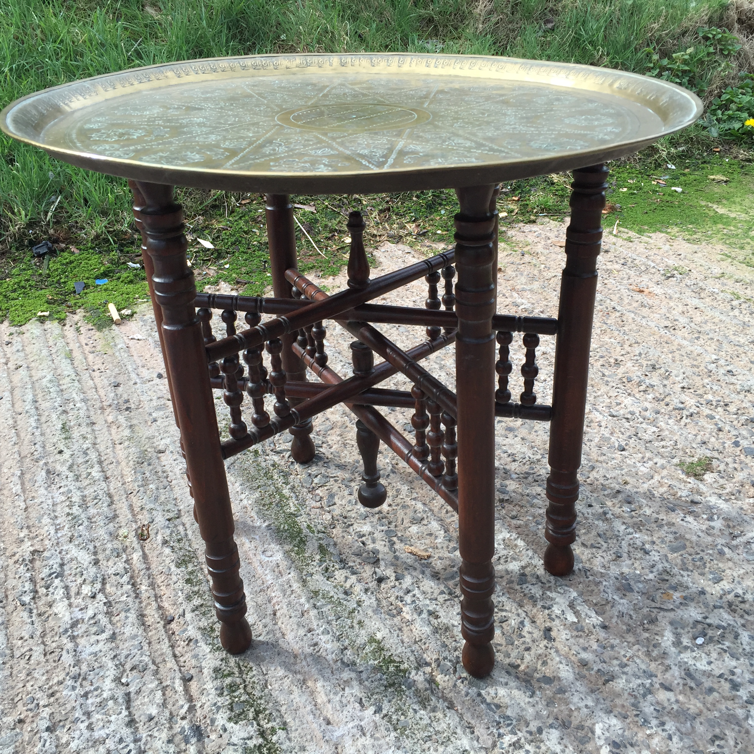 A brass tray top travelling table with folding base.