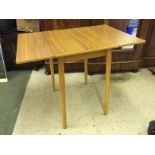 A formica Pembroke style table.