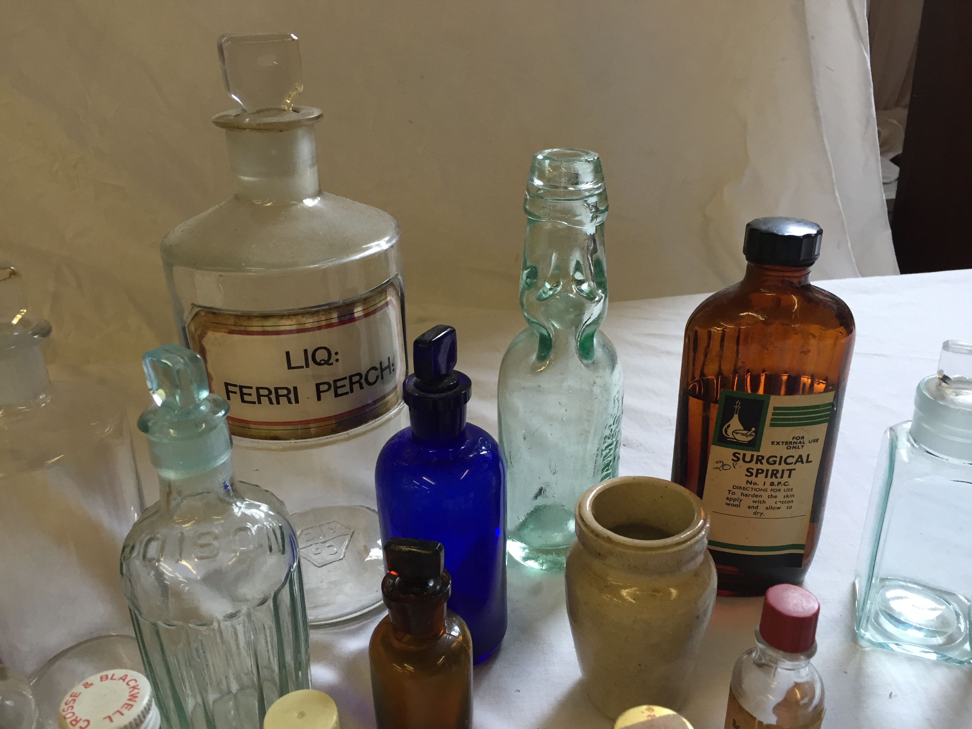 Twenty one glass bottles including clear chemist bottle, blue glass and brown. - Image 2 of 3