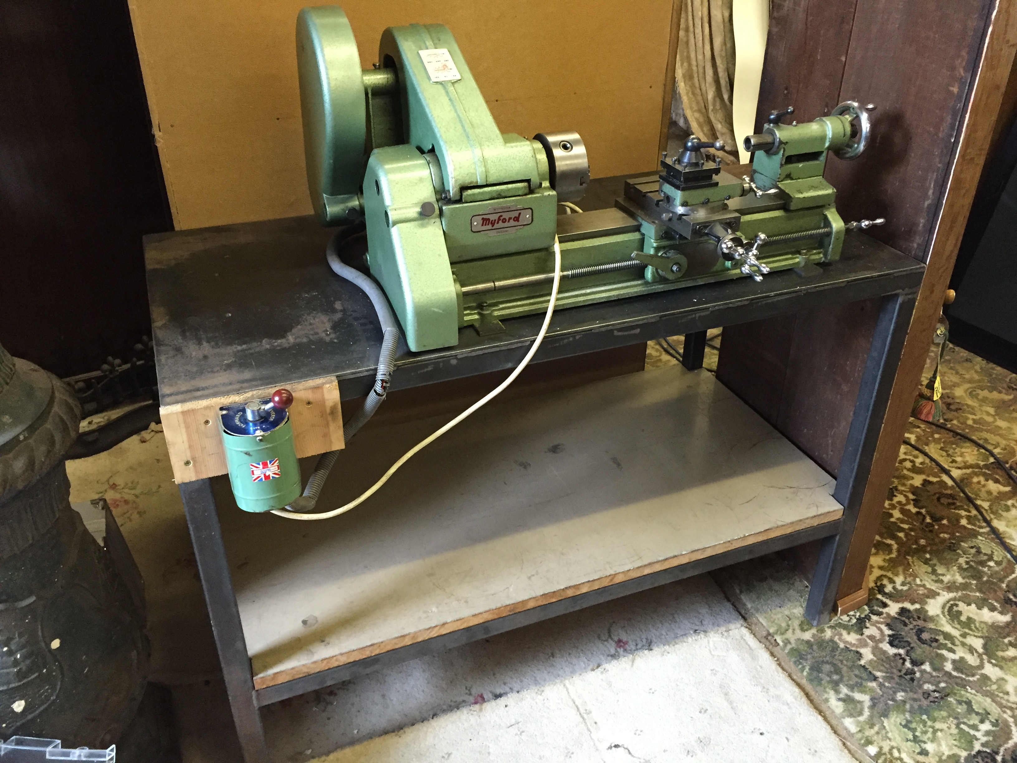 A Myford metal lathe Nottingham England mounted on a steel box tube bench.