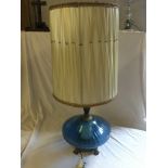 Two large table lamps 90mm with blue glass bases.