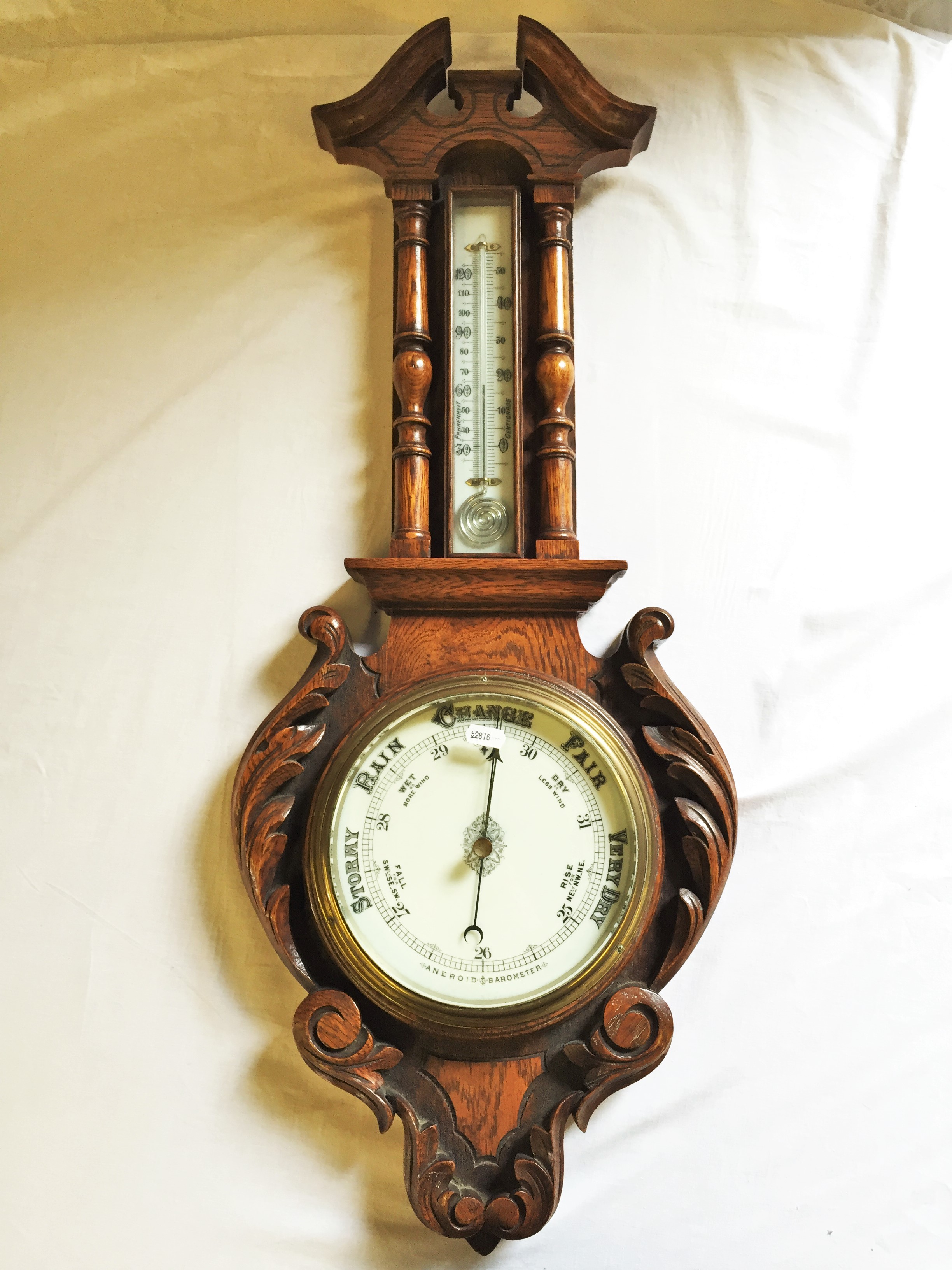 A Victorian Oak Banjo Barometer 840 mm H by Kerr and Mackeller Silversmiths Glasgow with a snail