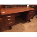 A 70's office desk with three drawers to either side.