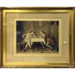 A Victorian print of two gentlemen in a gilt frame with pencil signature.