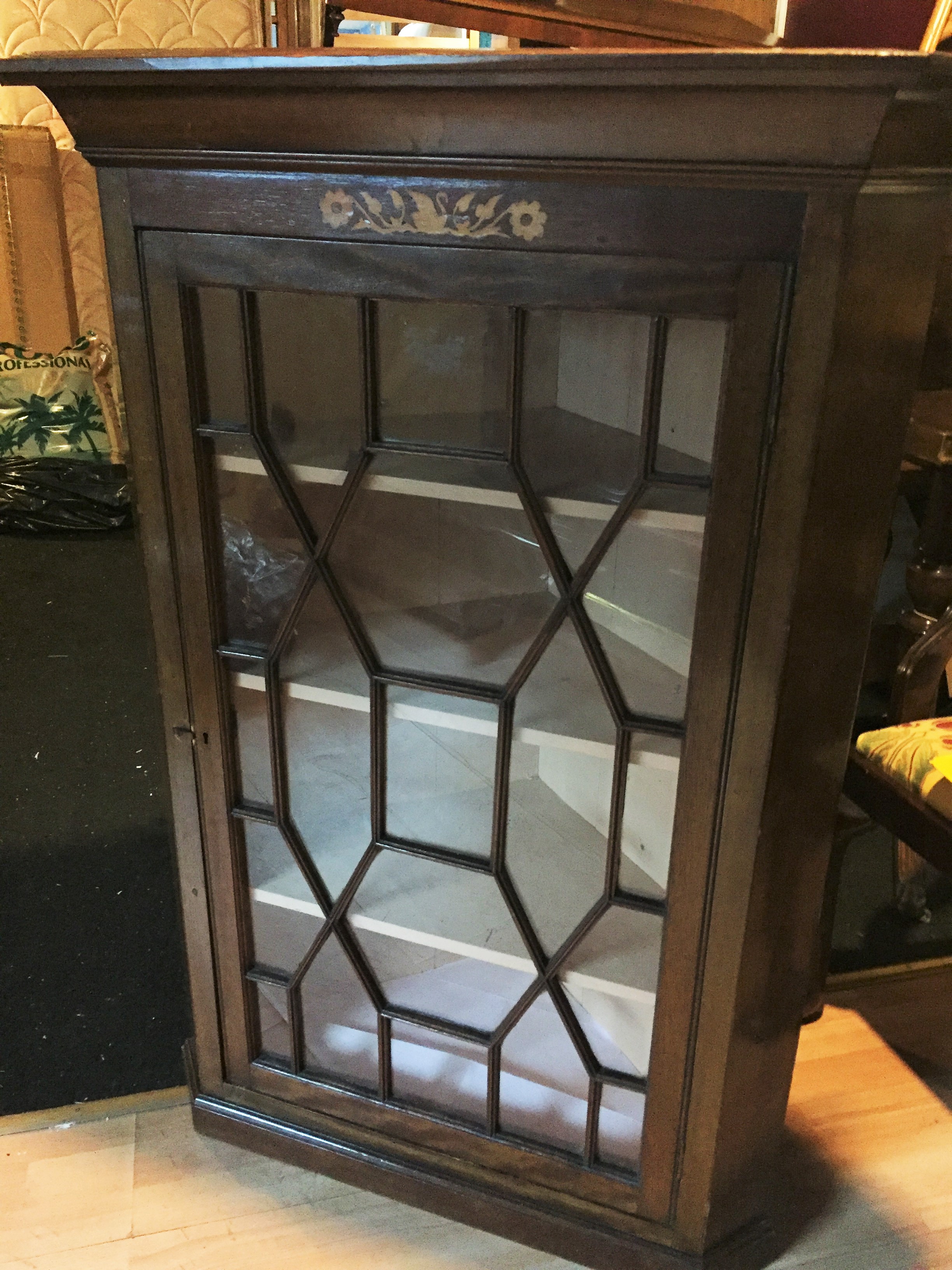 A Georgian astral glazed oak corner cabinet.