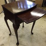 A small side table with Queen Anne legs wit brushing shelf over one drawer.