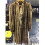 A full length fur coat.