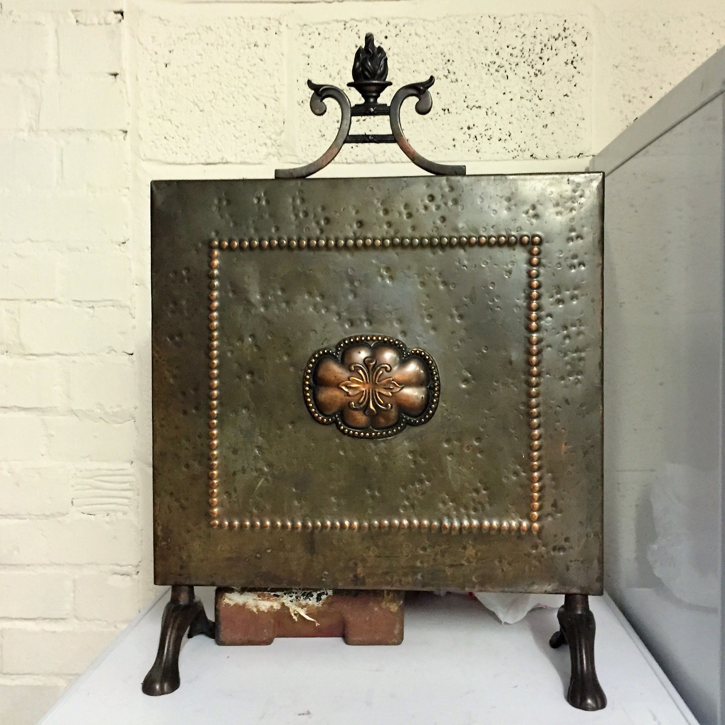 An Arts and crafts brass and copper fire screen.