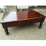 A dark wood coffee table 450 mm x 120 mm x 790 mm (Showroom 2)