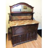 A mirror backed marble topped wash stand with cupboard above two drawers.