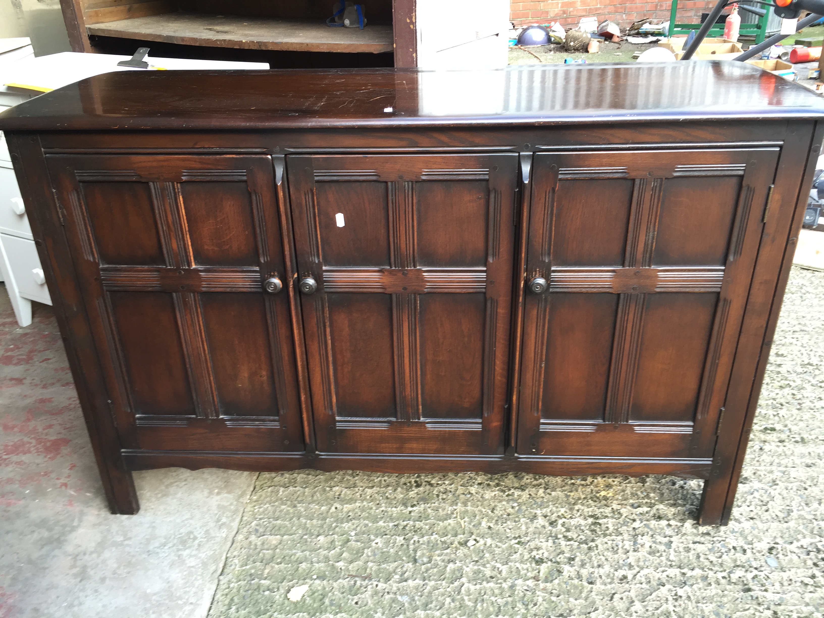 A dark wood sideboard.