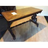 A decorative hall side table with central stretcher and fretwork side suports.