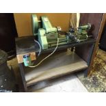 A Myford metal lathe Nottingham England mounted on a steel box tube bench.