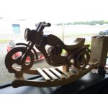 A wooden rocking motorbike.