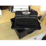 An Underwood typewriter with case.