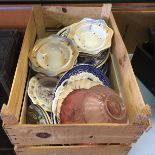 A box of various mixed ceramics.