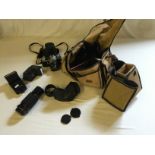 A Pentax camera, lenses and flashes with bag.