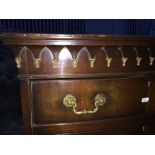 A mahogany bow fronted chest on chest having moulded cornice to top and four graduated drawers to