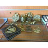 A selection of brass horse brasses and other figures.