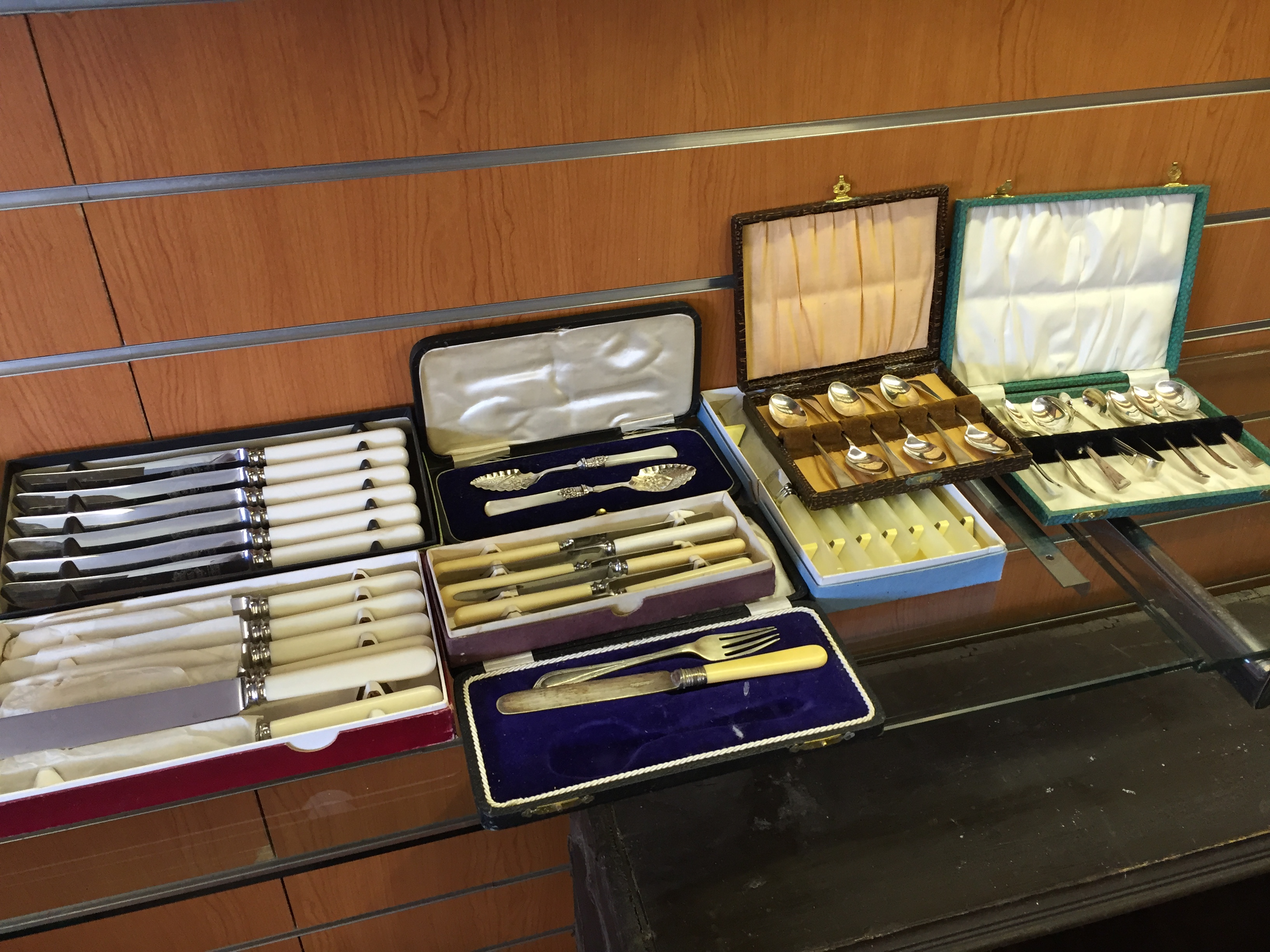 Various boxed flatware and silver plate.
