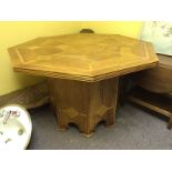 An octagonal fruit wood table having cen