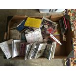 A box containing various compact discs.