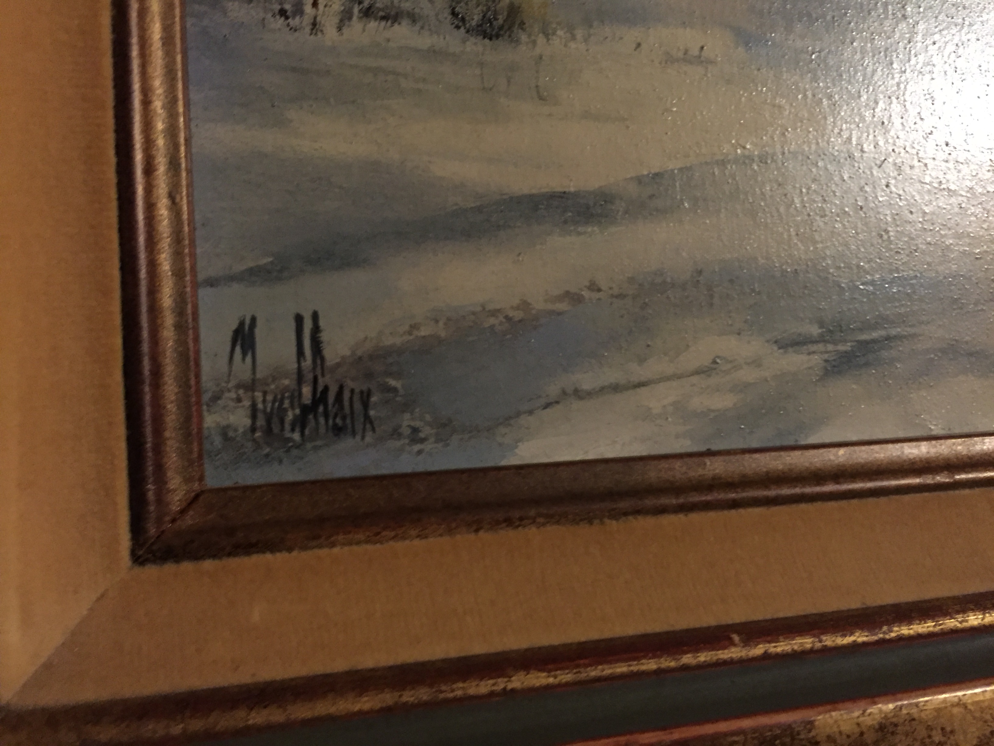 A framed winter scene picture.