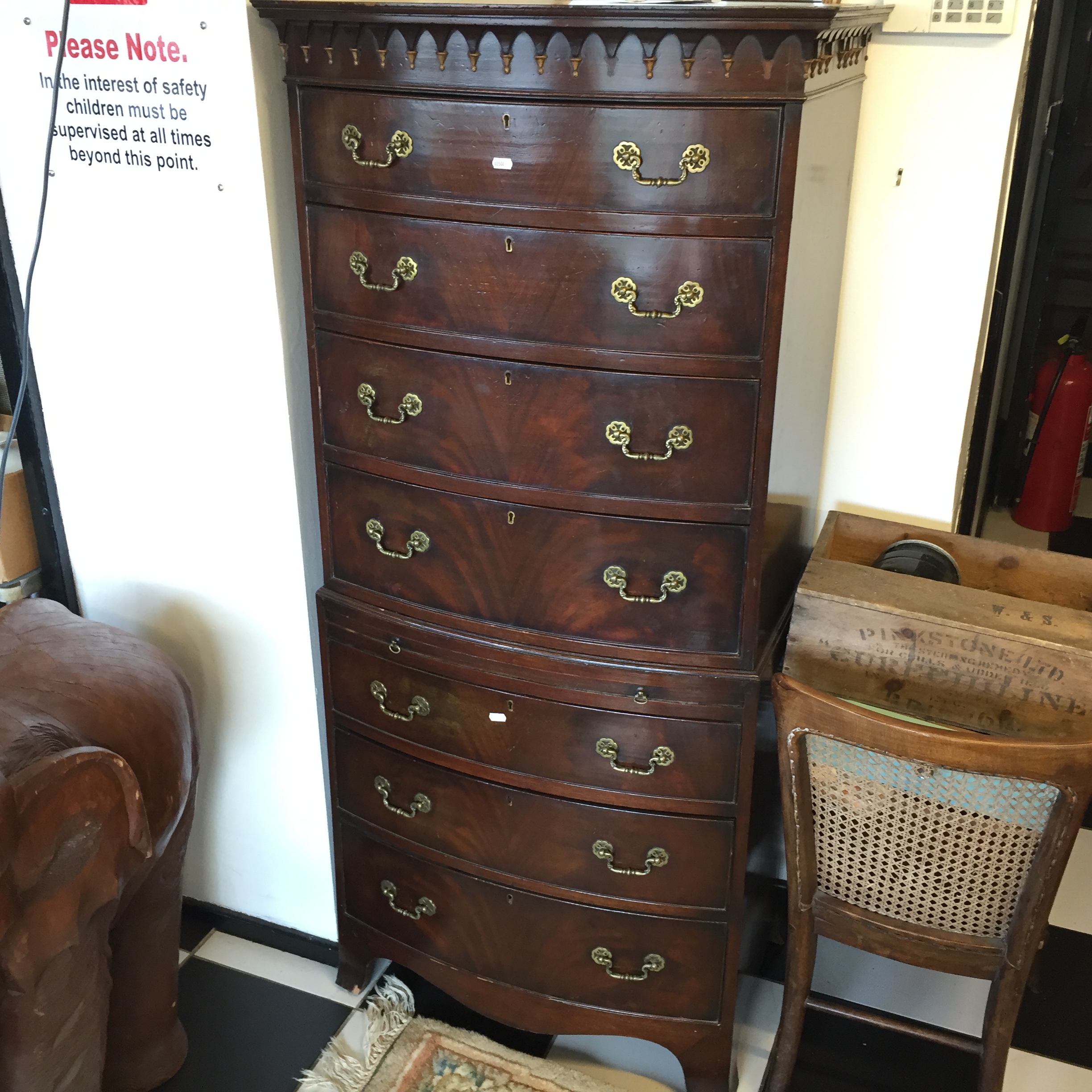 A mahogany bow fronted chest on chest having moulded cornice to top and four graduated drawers to