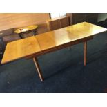 A teak White and Newton 1974 extending dining table.