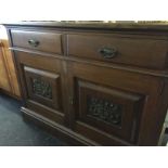 A large mirror backed sideboard.