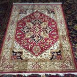 A red ground Heriz carpet. 1.9 m x 1.