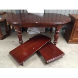 A large mahogany winding dining table 760 mm x 2730 mm x 1100 mm.