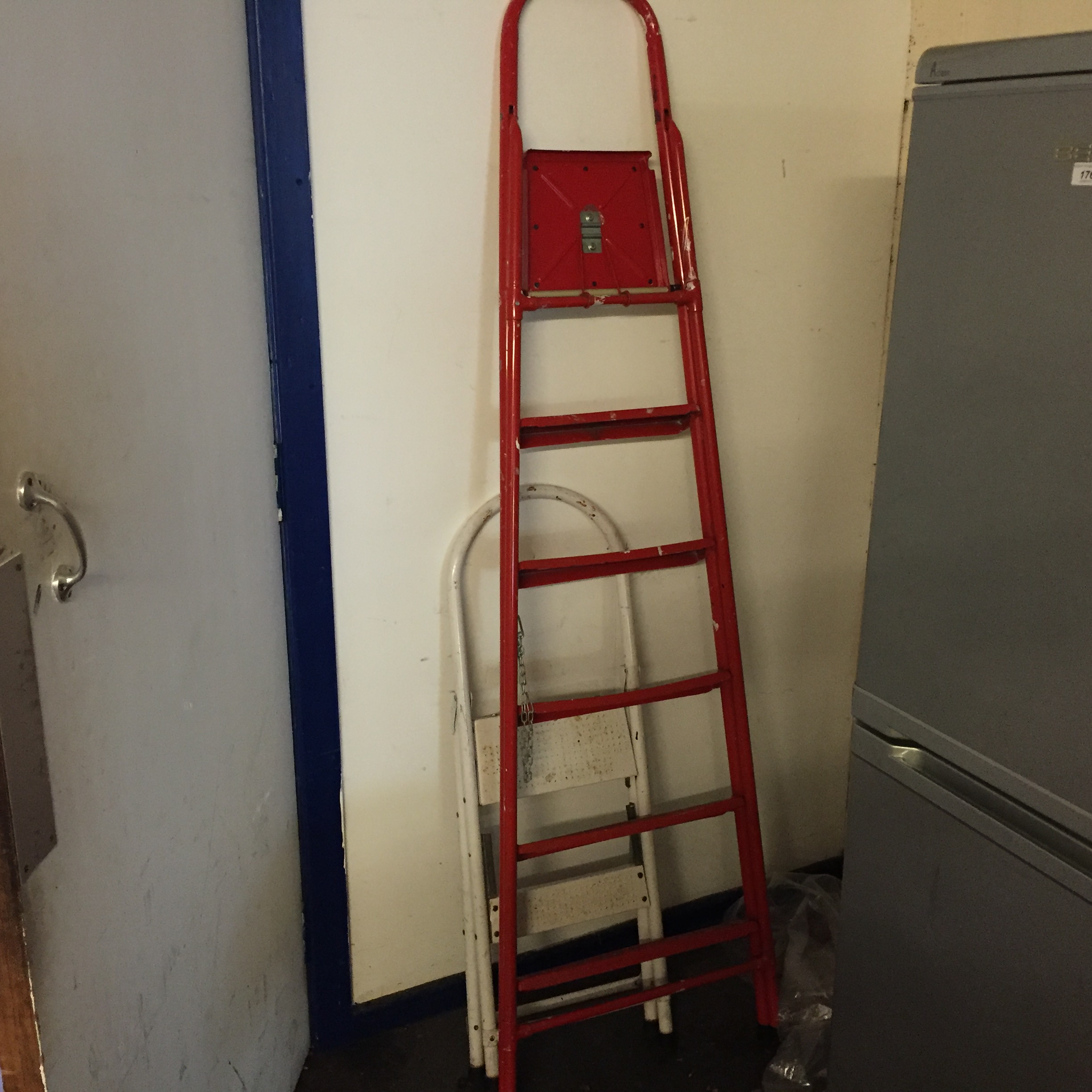 Two sets of step ladders.