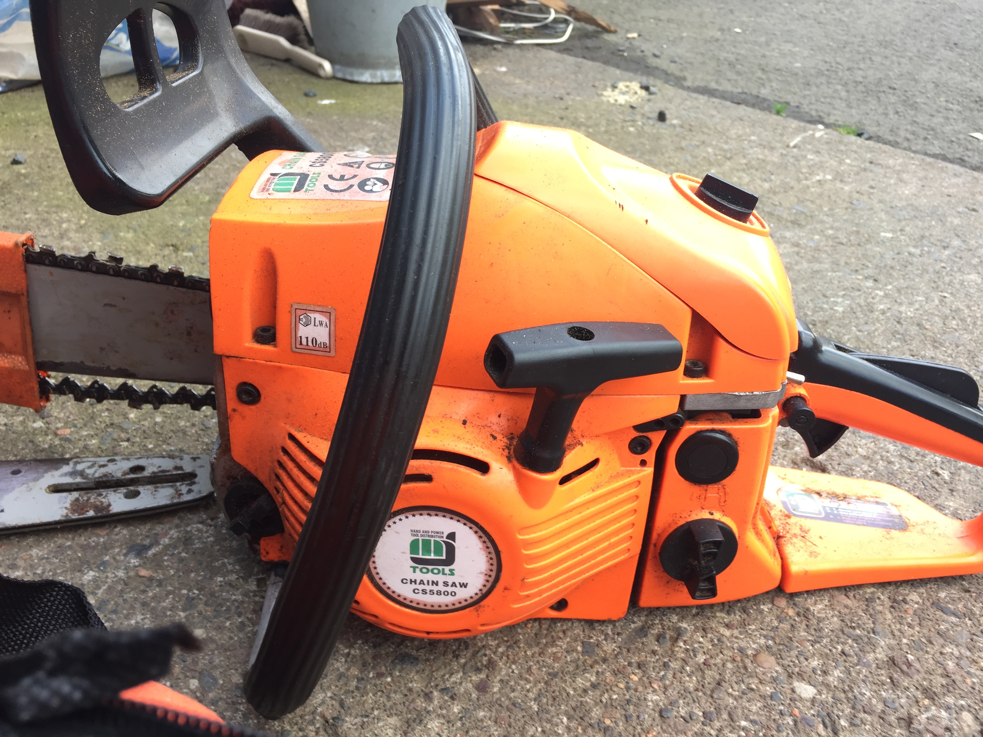 Chain saw with spare bar and two spare chains.