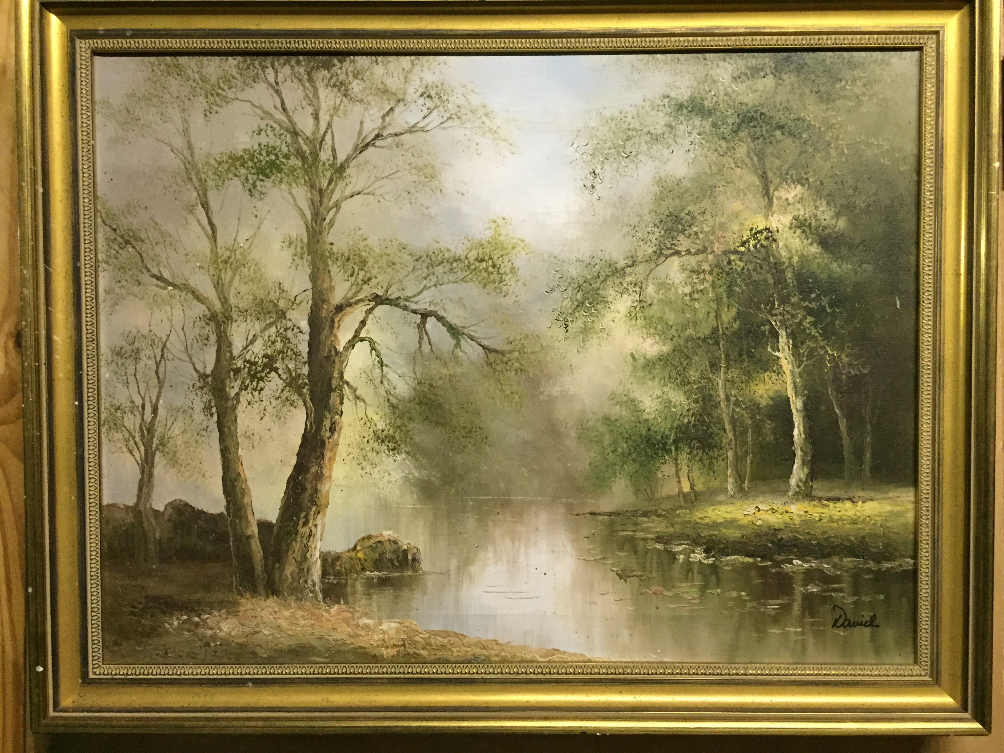 An oil depicting a river scene.