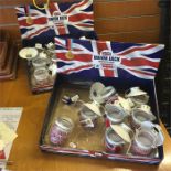 Two boxes of Union Jack tea light holders