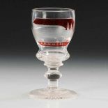 Ansichtenkelchglas. Böhmen, um 1850/60. Farbloses, teils rot gebeiztes Glas. Glockenkuppa,
