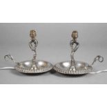 Paar Silberlampen Italien Mitte 20. Jh, gestempelt 800, in Form alter Handleuchter, auf eingerollten