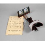 Stereoskop-Bildbetrachter Anfang 20. Jh., ungemarkt, einfaches Holzgestell mit Metallschutz,