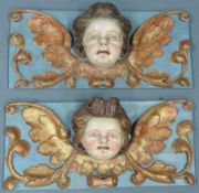 Zwei barocke Putti-Köpfe. Reliefs.56 cm x 26 cm. Holz geschnitzt. Farbig gefasst, Reste von