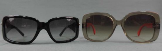 Eine Fendi Sonnenbrille und eine Salvatore Ferragamo Sonnenbrille. Gebrauchsspuren. A pair of