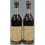 Grande fine Champagne André Couprie. 1 x Napoléon und 1 x V.S.O.P. 2 ganze Flaschen Cognac.