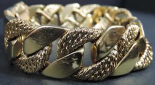 Panzerarmband Gelbgold 750. gestempelt "Cliquet". Verschluss und Hebelsicherung. 103,2 Gramm.