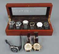 9 Herrenarmbanduhren. Modern. Dazu Uhrenkasten. 9 Men's Watches. Modern. And a case.